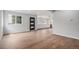 The new light wood flooring in the spacious living room continues to the open floor plan of the home at 1990 Ulster St, Denver, CO 80220