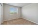 Bright bedroom featuring carpet, a large window, and a neutral color palette at 7220 Big Thompson Ct, Frederick, CO 80530