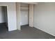 A well-lit bedroom featuring soft carpet and a closet with folding doors at 4570 E Yale Ave # 706, Denver, CO 80222