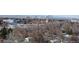 View of the city skyline and residential neighborhood with bare winter trees from atop a highrise at 4570 E Yale Ave # 706, Denver, CO 80222