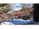 Beautiful backyard featuring rocky outcrop, natural surroundings, and glimpses of nature's beauty at 6260 Rain Dance Trl, Littleton, CO 80125