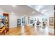 Spacious basement featuring a fireplace, hardwood floors, and plenty of storage space at 6260 Rain Dance Trl, Littleton, CO 80125