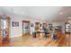 Open concept basement with wood floors, display cabinets, and great natural light at 6260 Rain Dance Trl, Littleton, CO 80125