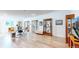 Spacious basement area with hardwood floors, built-in display cabinets, and natural light from the window at 6260 Rain Dance Trl, Littleton, CO 80125