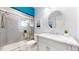 Recently renovated bathroom with a glass shower and a bright, modern vanity at 6260 Rain Dance Trl, Littleton, CO 80125