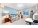 Well lit bedroom with a daybed, musical instruments and desk space at 6260 Rain Dance Trl, Littleton, CO 80125