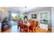 Elegant dining room featuring a sliding glass door to the outside deck and hardwood floors at 6260 Rain Dance Trl, Littleton, CO 80125