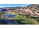 The home is located in a golf course community with a lake and mountain views at 6260 Rain Dance Trl, Littleton, CO 80125