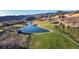 The golf course community offers a peaceful lake with scenic mountain views at 6260 Rain Dance Trl, Littleton, CO 80125