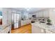 Modern kitchen features stainless steel appliances, granite countertops, and light gray cabinetry at 6260 Rain Dance Trl, Littleton, CO 80125