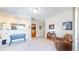 Spacious living room with neutral walls, plush carpet, and a leather recliner at 6260 Rain Dance Trl, Littleton, CO 80125