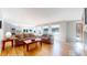 Inviting living room with hardwood floors, lots of natural light, and an open floor plan at 6260 Rain Dance Trl, Littleton, CO 80125