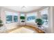 Sunny breakfast nook with lots of windows and hardwood floors at 6260 Rain Dance Trl, Littleton, CO 80125