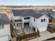 An aerial view of a modern home showcasing backyard and spacious outdoor living area at 5835 Chester Way, Denver, CO 80238