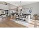Bright dining area showcasing a stylish chandelier, contemporary art, and an open floor plan at 5835 Chester Way, Denver, CO 80238