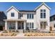 Stunning two-story home with solar panels, inviting porch, and beautifully landscaped front yard at 5835 Chester Way, Denver, CO 80238