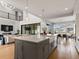 Spacious kitchen with an island, open to the living and dining areas, perfect for entertaining at 5835 Chester Way, Denver, CO 80238