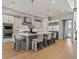 Modern kitchen featuring a large island, stainless steel appliances, and sleek cabinetry at 5835 Chester Way, Denver, CO 80238