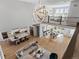 Spacious open-concept living space with modern decor, a large kitchen, and abundant natural light from numerous windows at 5835 Chester Way, Denver, CO 80238
