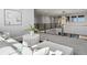 Cozy loft with plush seating, stylish decor, and views of the modern light fixture and open living space below at 5835 Chester Way, Denver, CO 80238