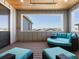 Relaxing outdoor patio with comfortable lounge furniture and a view of surrounding homes at 5835 Chester Way, Denver, CO 80238