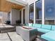 Relaxing outdoor patio featuring a modern fire pit and comfortable seating area at 5835 Chester Way, Denver, CO 80238