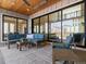 Inviting covered patio with comfortable seating, ceiling fan, and seamless indoor-outdoor flow at 5835 Chester Way, Denver, CO 80238