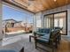 Outdoor patio with modern furniture, smooth concrete and access to backyard at 5835 Chester Way, Denver, CO 80238