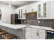 Modern wet bar featuring a sink, wine fridge, and stylish cabinetry, perfect for entertaining in style at 5835 Chester Way, Denver, CO 80238