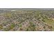 Wide aerial shot showcases the community layout and the surrounding natural landscape at 15887 W Ellsworth Ln, Golden, CO 80401