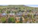 Expansive aerial view of a charming neighborhood with mountain views and lush landscaping at 15887 W Ellsworth Ln, Golden, CO 80401
