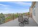 Relaxing deck with outdoor dining set and scenic views of the surrounding landscape at 15887 W Ellsworth Ln, Golden, CO 80401