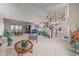 Large living room with elegant stairway, many plants, and open concept dining area at 15887 W Ellsworth Ln, Golden, CO 80401