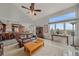 Bright living room with a view, featuring a cozy seating area and access to the kitchen at 15887 W Ellsworth Ln, Golden, CO 80401