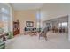 Open concept living room area with high ceilings and natural light from many windows at 15887 W Ellsworth Ln, Golden, CO 80401