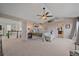 Tranquil main bedroom with a sitting area, ensuite bathroom, and ample natural light at 15887 W Ellsworth Ln, Golden, CO 80401
