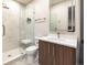 Modern bathroom with marble tiled walk-in shower, sleek vanity, and stylish fixtures at 40 Royal Ann Dr, Greenwood Village, CO 80111