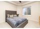 Cozy bedroom featuring a plush, upholstered bed and egress window for natural light and safety at 40 Royal Ann Dr, Greenwood Village, CO 80111
