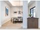 Stylish dining room with modern lighting, seating for six, and elegant decor at 40 Royal Ann Dr, Greenwood Village, CO 80111