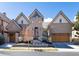 Charming home with a brick exterior, mature trees, and a well-manicured front yard at 40 Royal Ann Dr, Greenwood Village, CO 80111