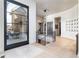Inviting foyer with modern chandelier, hardwood floors, and staircase at 40 Royal Ann Dr, Greenwood Village, CO 80111
