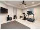 Well-equipped home gym with a variety of workout equipment, a ceiling fan, and natural light at 40 Royal Ann Dr, Greenwood Village, CO 80111