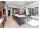Open kitchen with stainless steel appliances, a large island with seating, and plenty of natural light at 40 Royal Ann Dr, Greenwood Village, CO 80111