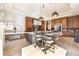 Bright kitchen features a large island with seating, modern lighting, and high-end stainless steel appliances at 40 Royal Ann Dr, Greenwood Village, CO 80111