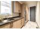 Well-lit laundry room offers stainless steel washer and dryer, ample cabinet space, and modern fixtures at 40 Royal Ann Dr, Greenwood Village, CO 80111