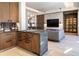 The living room features custom millwork, modern wet bar, and an open floor plan at 40 Royal Ann Dr, Greenwood Village, CO 80111
