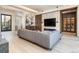 Cozy living room features a large sectional sofa, modern shelving, and an open floor plan at 40 Royal Ann Dr, Greenwood Village, CO 80111