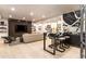 Stylish basement living room with a sleek bar area, modern TV, and comfortable seating at 40 Royal Ann Dr, Greenwood Village, CO 80111