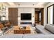 Inviting living room with modern fireplace, TV, and unique wood accents, perfect for relaxation and entertainment at 40 Royal Ann Dr, Greenwood Village, CO 80111