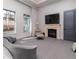 Spacious main bedroom with a fireplace, seating area, and natural light, creating a serene retreat at 40 Royal Ann Dr, Greenwood Village, CO 80111